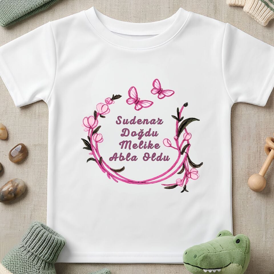 Kişiye Özel İsimli Çocuk Tişörtü – ''Abla Oldu'' Pembe Bahar Dalı Çelenkli Kardeş Doğum Duyurusu Pamuklu Çocuk Tişört